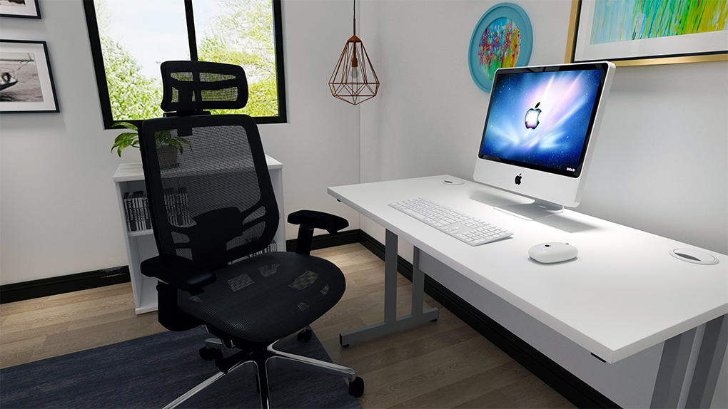 Home office with a computer screen, white keyboard and mouse on a white office desk with a grommet hole for cable management, with a black swivelling ergonomic office chair with mesh seat and black mesh back lumbar cushion and mesh headrest and height adjusting armrest support