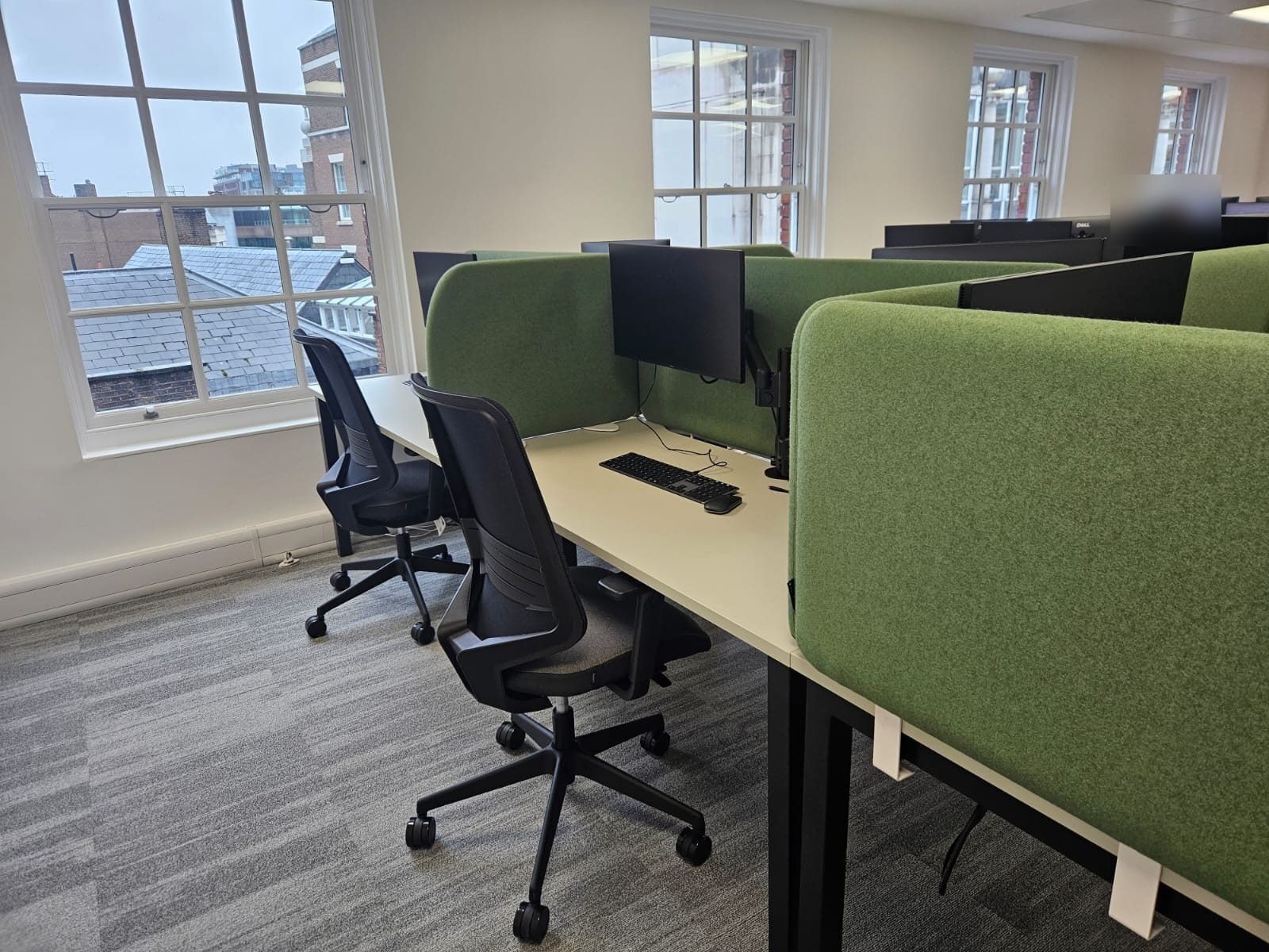 Hush 50 acoustic desk screens on bench brackets with monitor arms at Totum Partners, London
