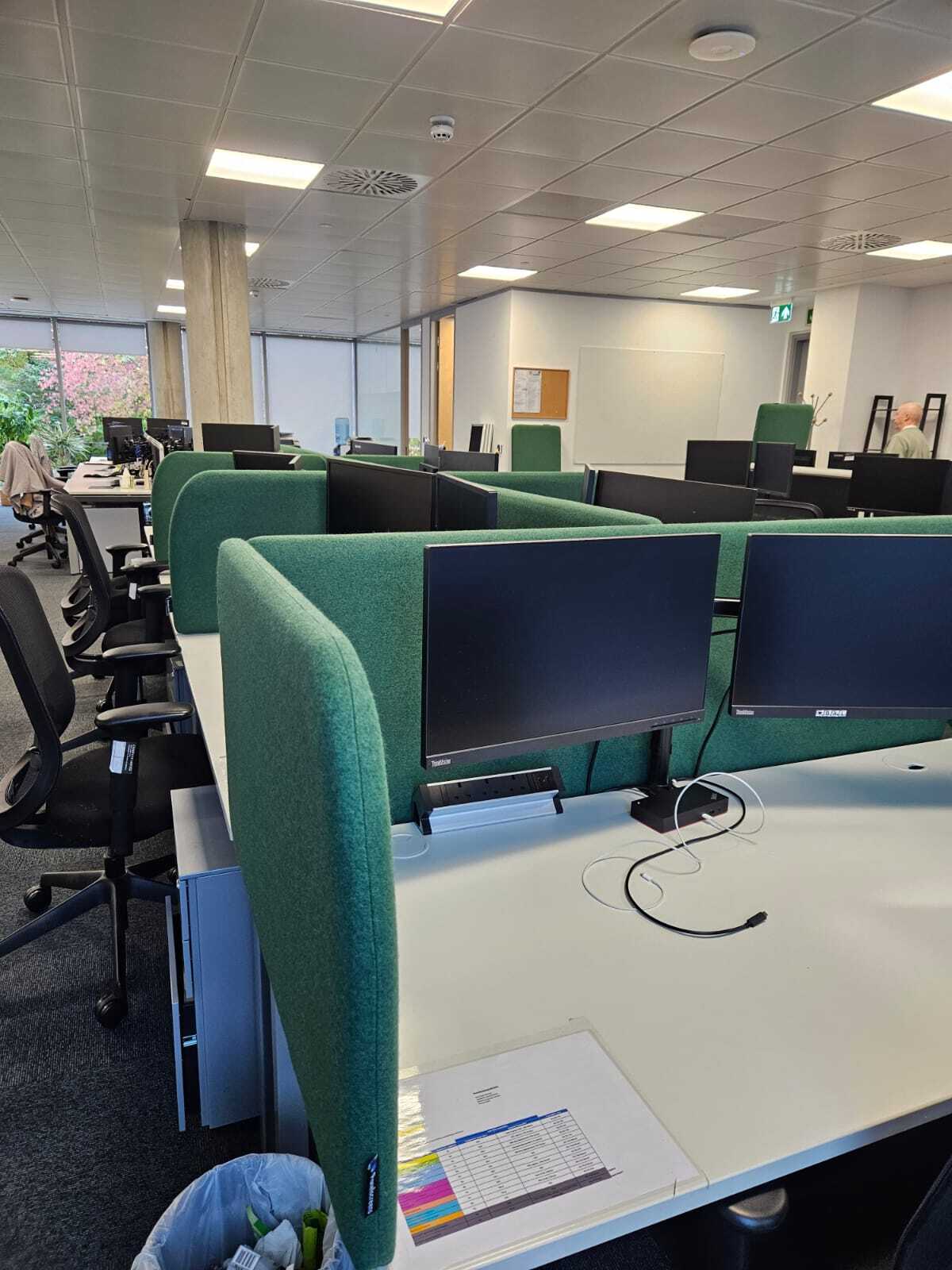 Acoustic desk dividers fitted around existing monitor arms