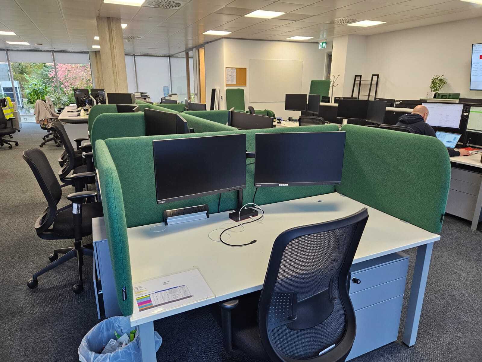 Bespoke acoustic desk screens with side returns at an end desk