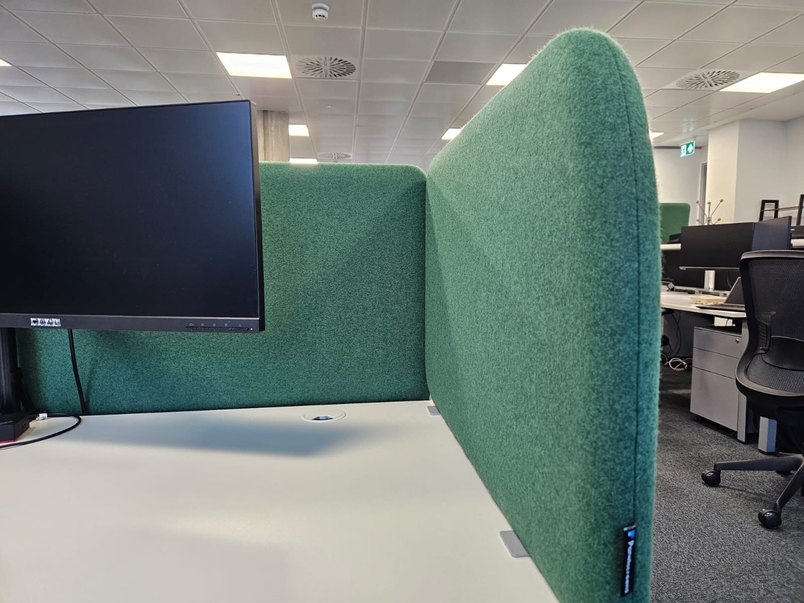 Close-up of an acoustic desk screen in Camira Blazer fabric